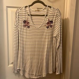 Light shirt with embroidered flowers